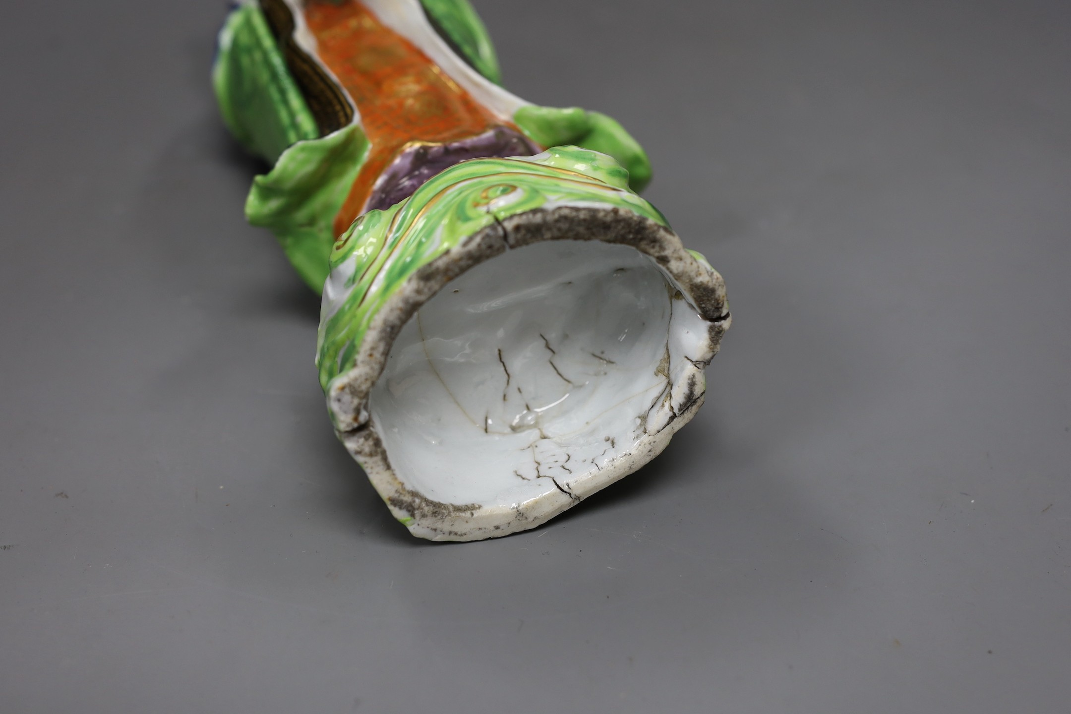 A Chinese enamelled porcelain figure of Guanyin, Jiaqing - Daoguang period, damage, 34cms high